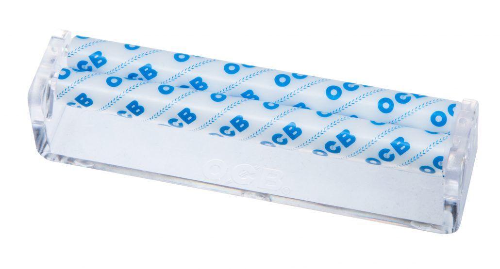 OCB Poacher Drehmaschine aus transparentem Kunststoff mit weißer Basis und blauem OCB-Schriftzug zur Unterstützung beim Drehen von Zigaretten.