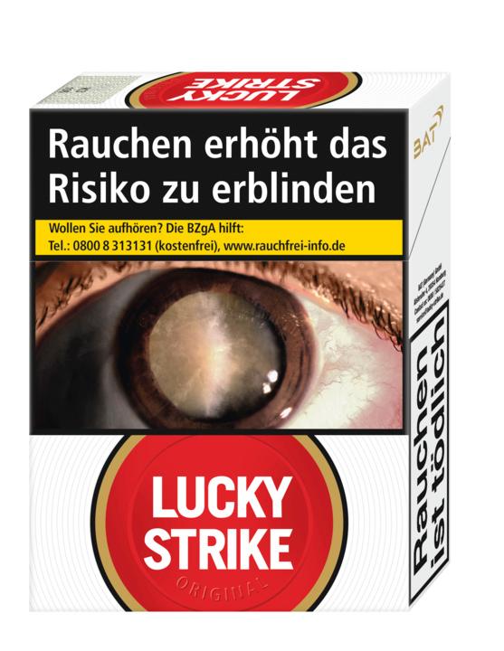 Lucky Strike Original Red XXL Zigarettenpackung mit 22 Stück Inhalt, weiße Verpackung mit rotem und goldenem Label, Abbildung eines Auges und dem Warnhinweis "Rauchen erhöht das Risiko zu erblinden".