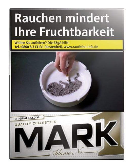 Mark One Gold Zigaretten in der 25 Stück Packung mit weißem Design, Herstellerhinweisen und gesetzlichem Warnhinweis vor dunklem Hintergrund.