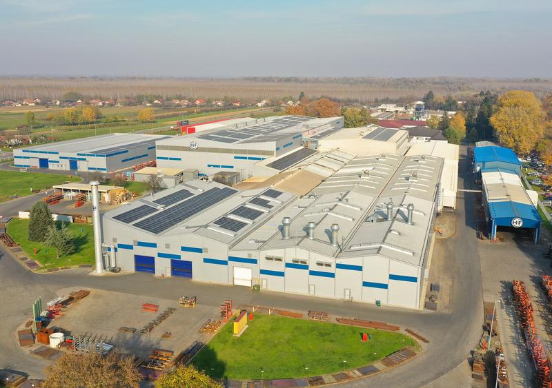 alt=”Picture shows extensive area with numerous industrial halls and office buildings in a rural setting in Belišće, Croatia.”