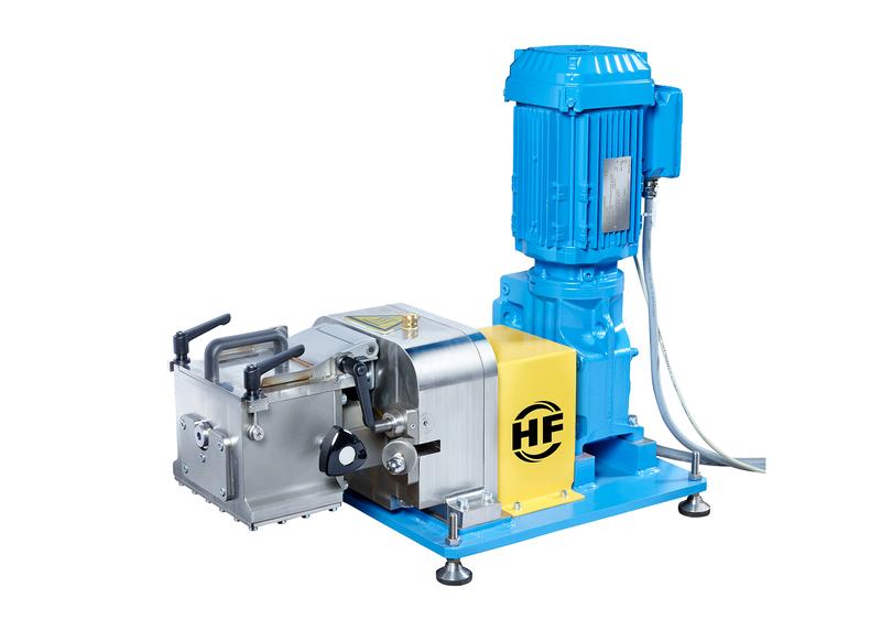 Compact blue laboratory mixer with motor drive, stainless steel housing, and yellow protective cover.